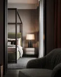Cozy bedroom with high designer luxury bed